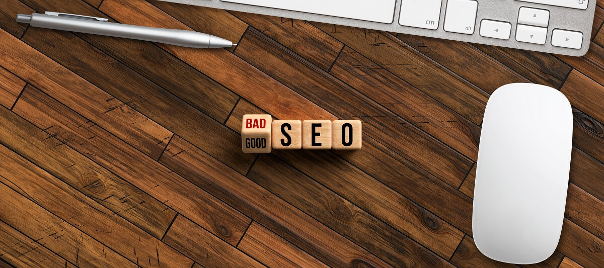 Good vs Bad SEO in Scrabble tiles with a computer and mouse